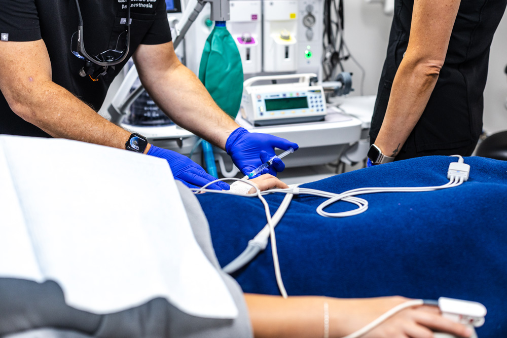 Patient receiving IV sedation during dental treatment